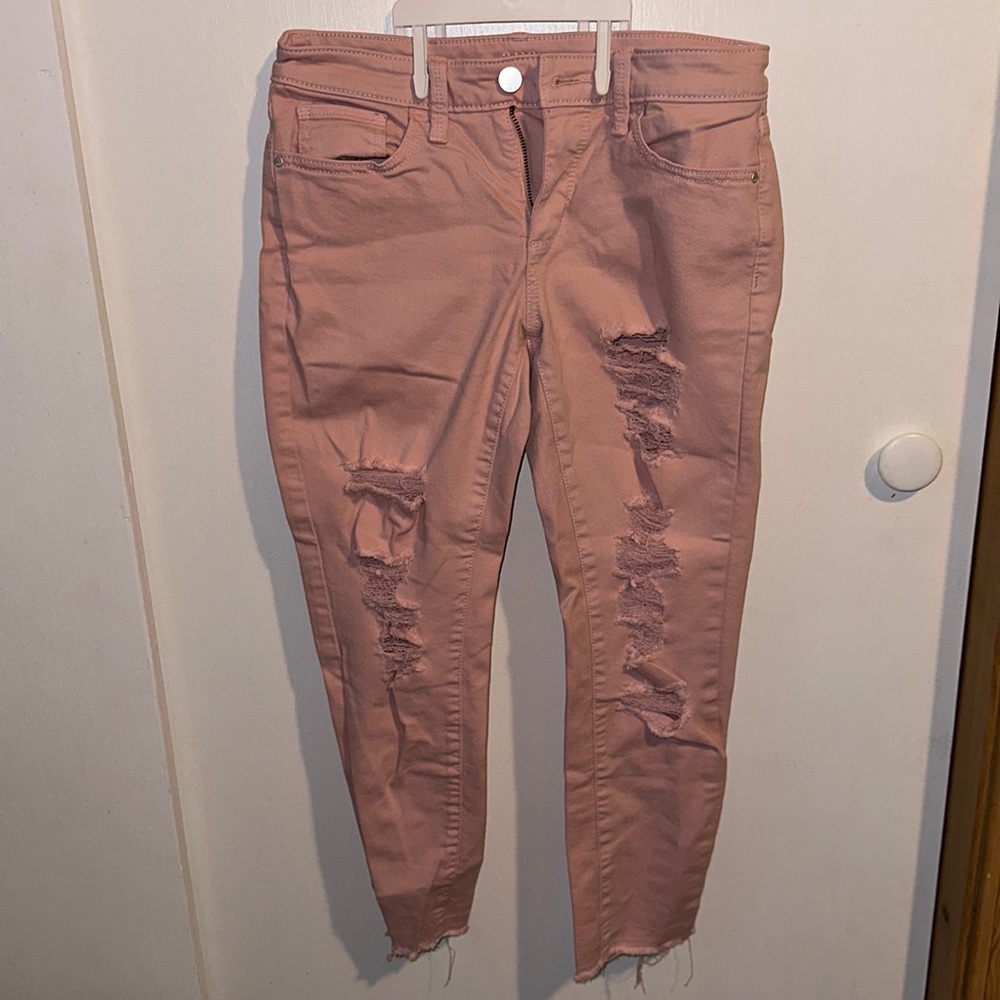 Pink ripped skinny jeans